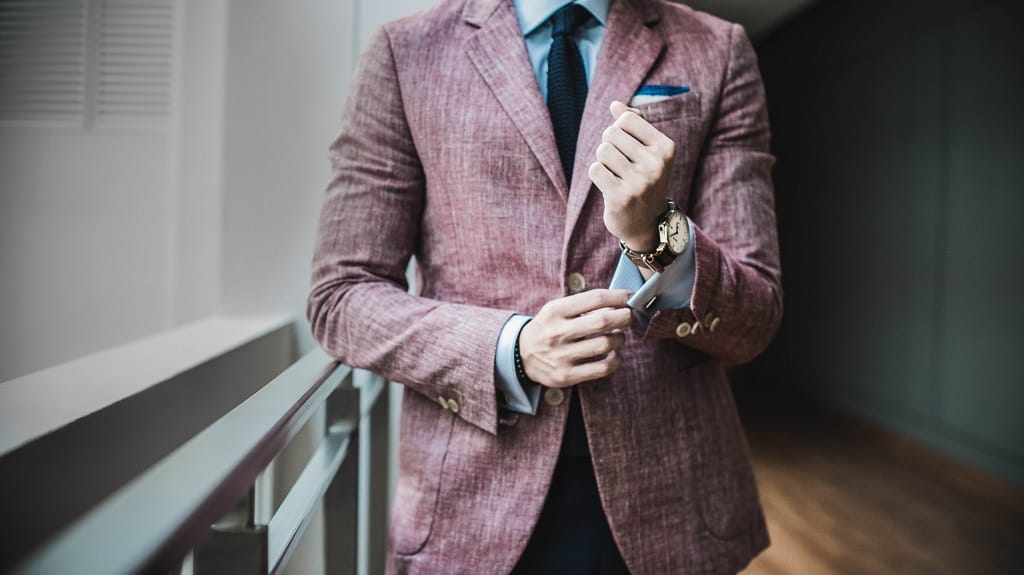 Man fixing his suit