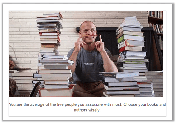 Man surrounded by books thinking